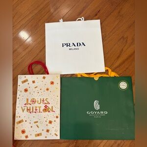 Prada, Louis Vuitton, and Goyard Shopping Bags